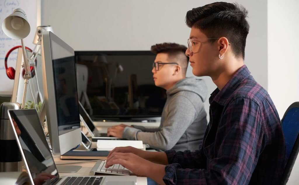 Developers working computers office