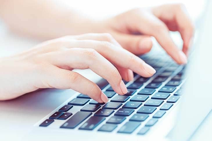 Woman hands type computer